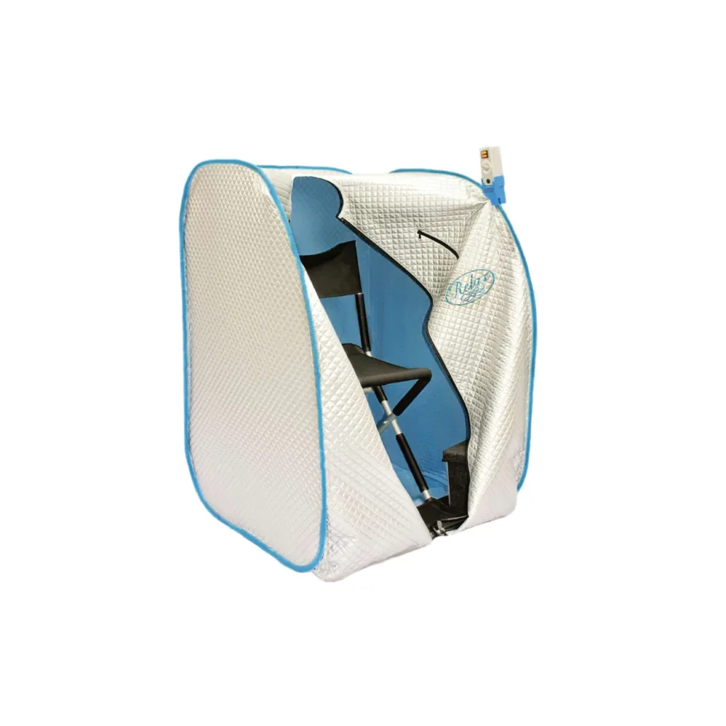 The original silver relax far infrared sauna - a small cube tent, white with blue edges - is unzipped. You can see the blue inside and the chair inside the cube.